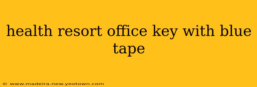 health resort office key with blue tape